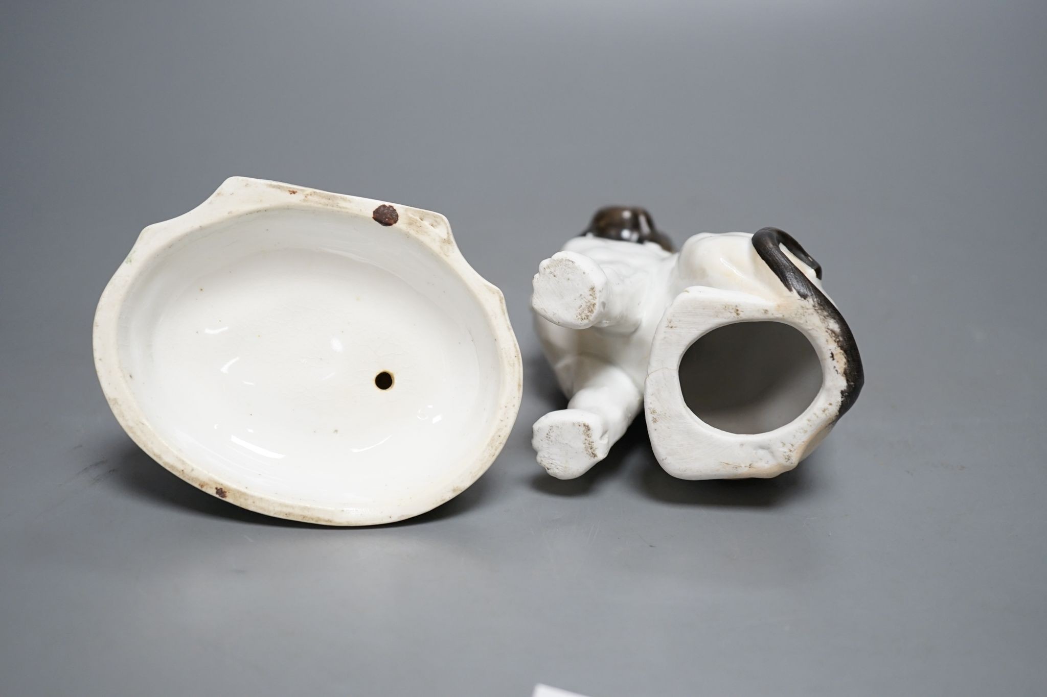 An English porcelain girl with sheep inkwell, c.1835 and a Continental porcelain pug dog, 14cm